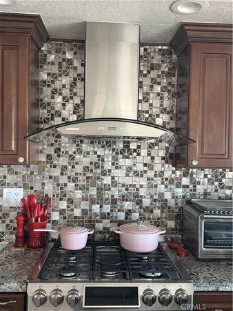 a room with a stove and a sink