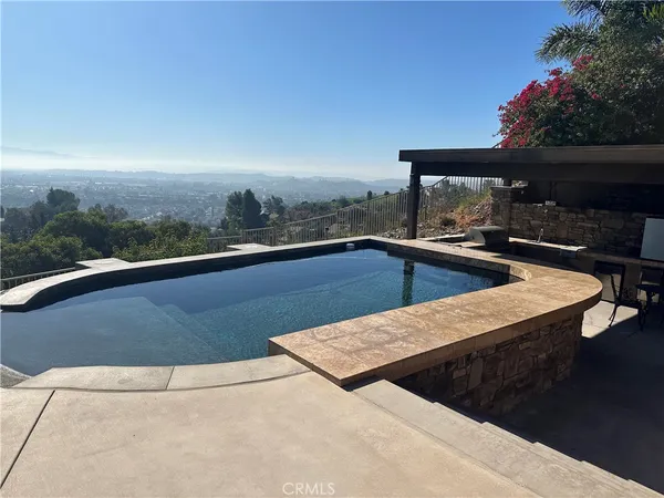 a view of outdoor space with swimming pool