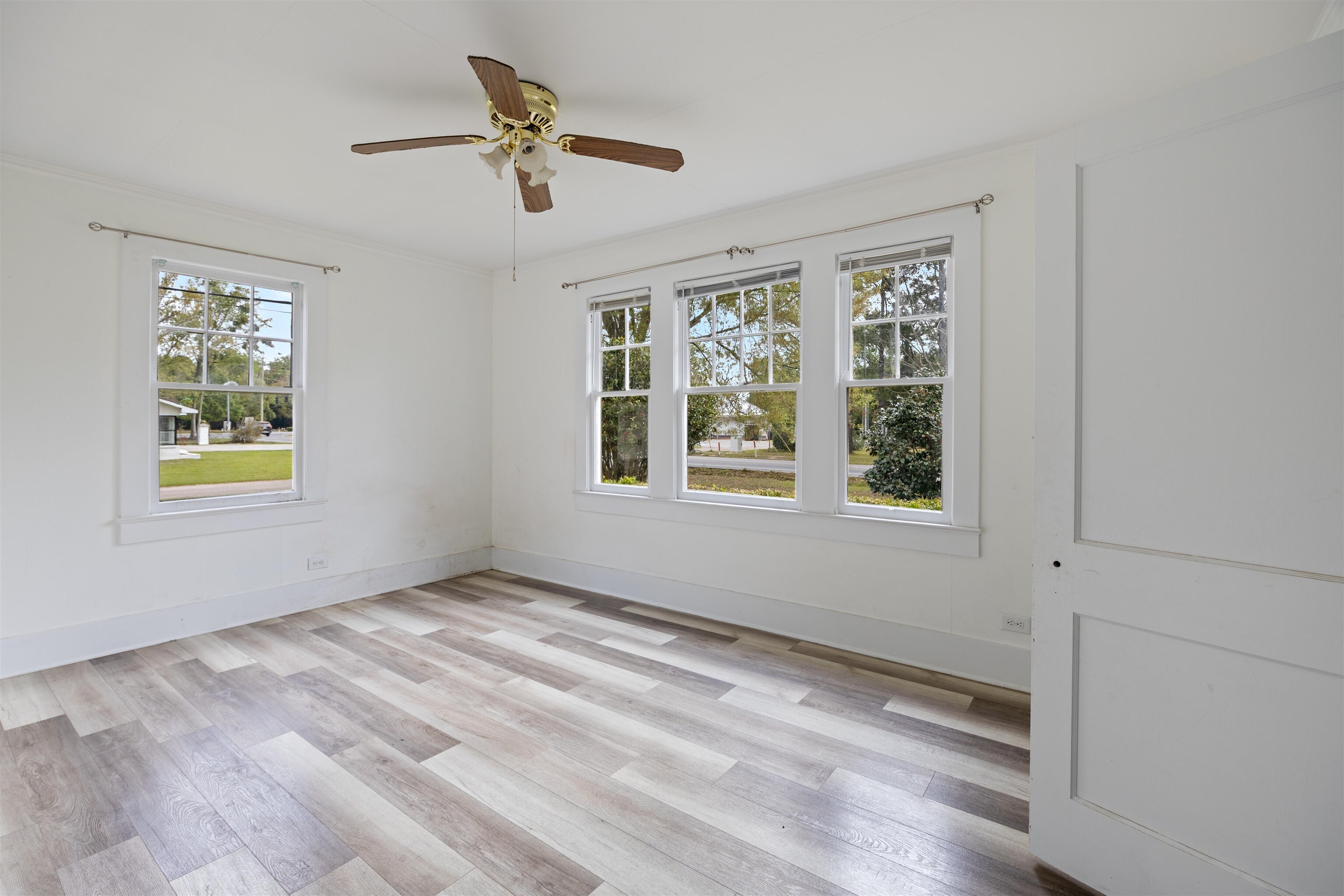 112 South Juniper Street Foley, AL 36535 - Photo 44 of 64 Unfurnished room featuring light wood-type flooring and a ceiling fan