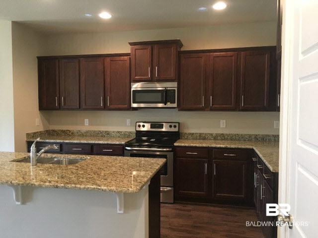 6618 Spaniel Drive, Unit 50B Spanish Fort, AL 36527 - Photo 3 of 16 This Kitchen features granite counter tops and stainless steel appliances.
