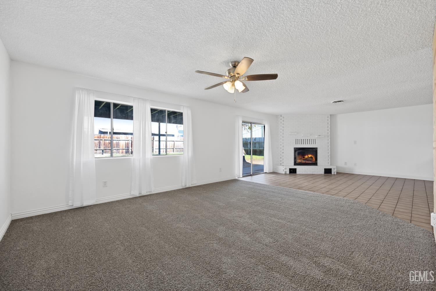 Undisclosed Address Bakersfield, CA 93312 - Photo 11 of 30 a view of an empty room with a window