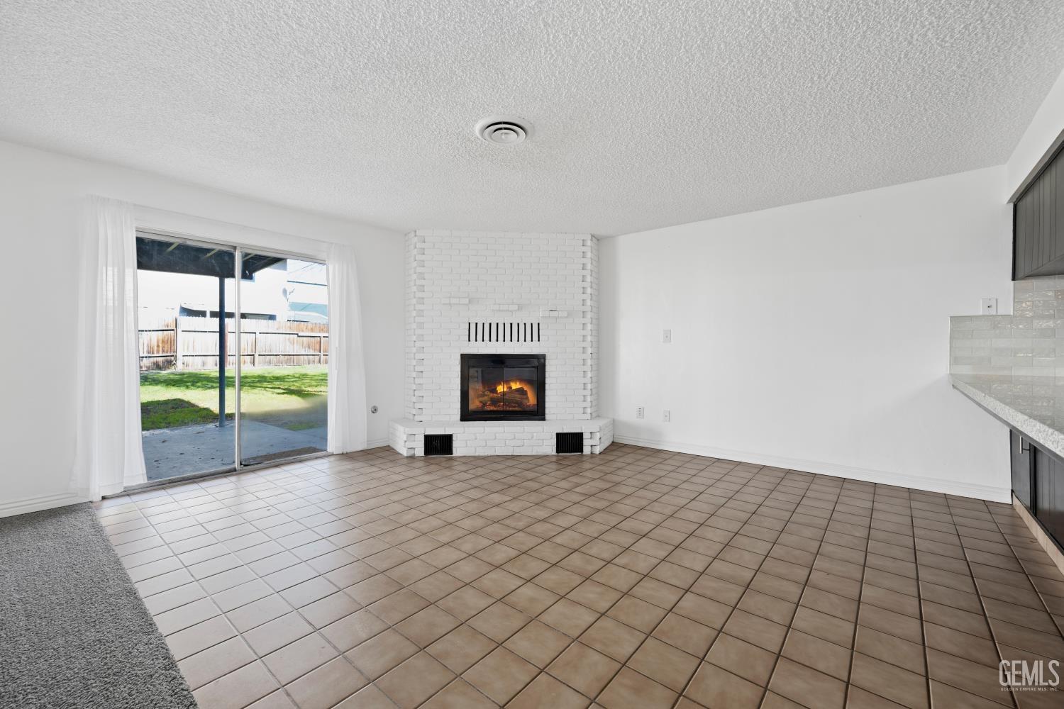 Undisclosed Address Bakersfield, CA 93312 - Photo 12 of 30 a view of an empty room with a window