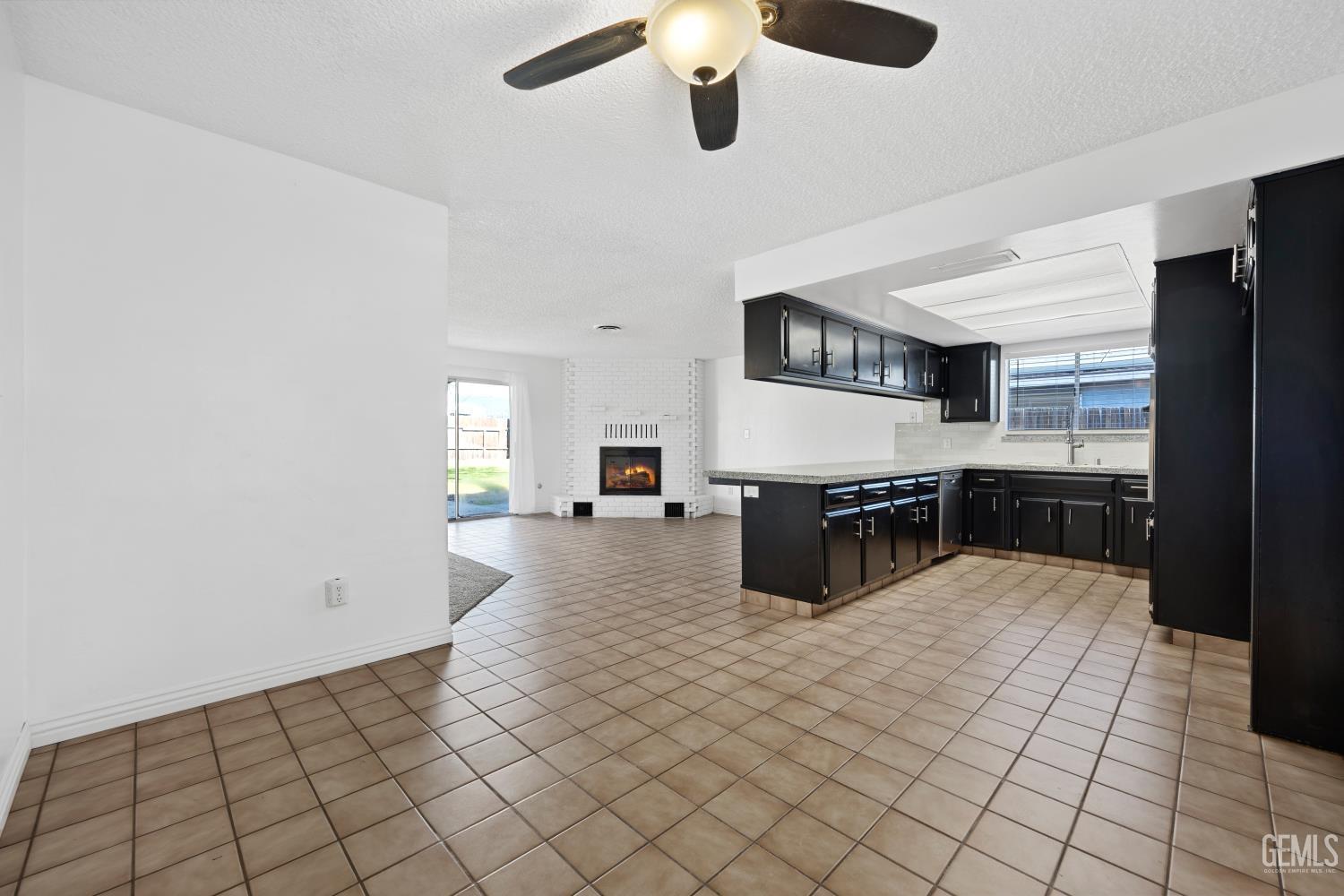 Undisclosed Address Bakersfield, CA 93312 - Photo 22 of 30 a kitchen with stainless steel appliances a sink and cabinets