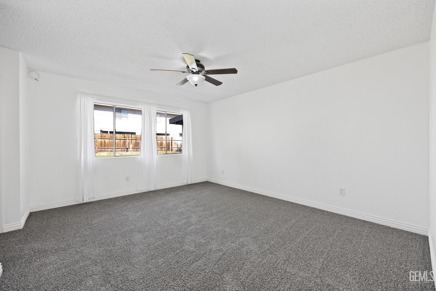 Undisclosed Address Bakersfield, CA 93312 - Photo 23 of 30 a view of an empty room with a window