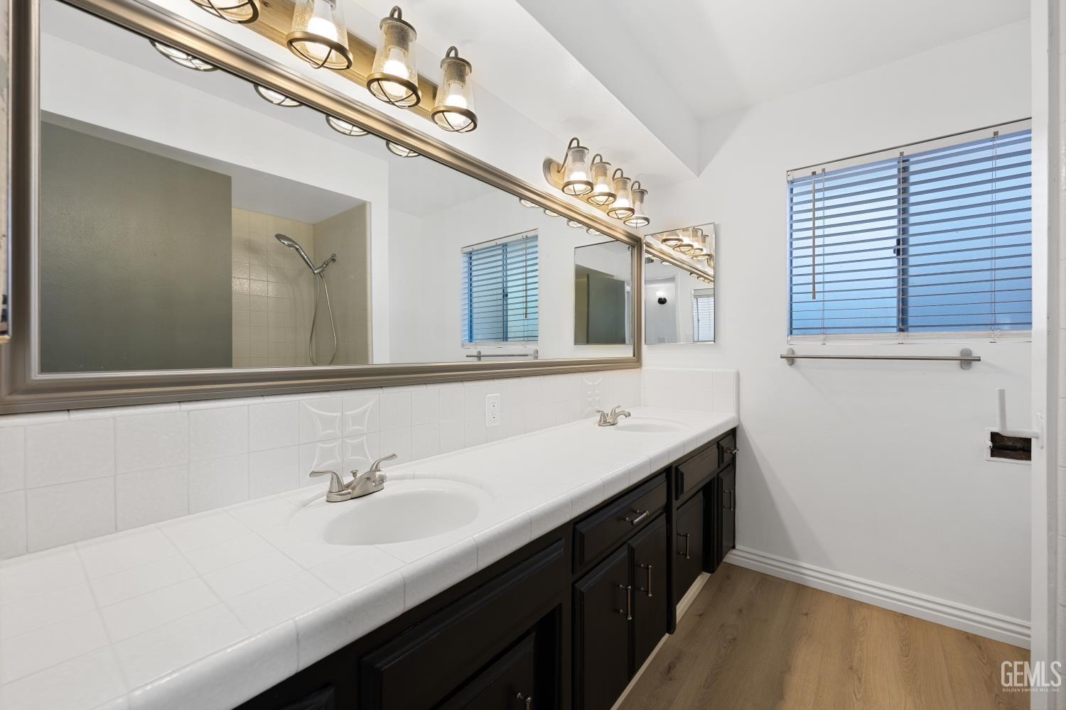 Undisclosed Address Bakersfield, CA 93312 - Photo 28 of 30 a bathroom with a sink double vanity granite and mirror