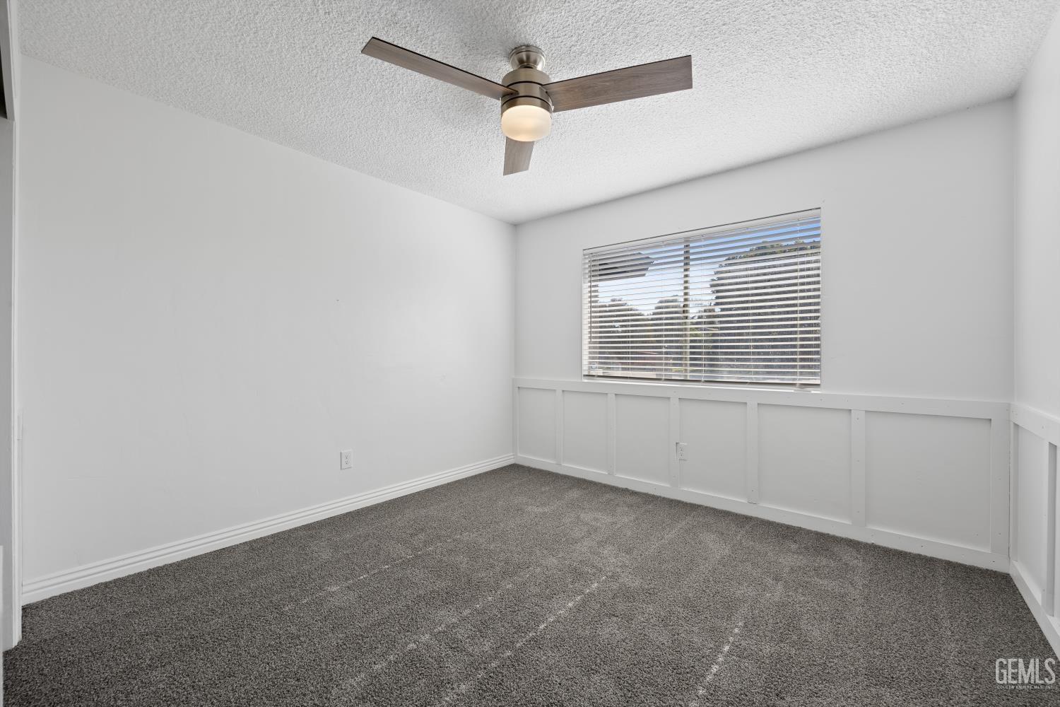 Undisclosed Address Bakersfield, CA 93312 - Photo 29 of 30 an empty room with windows and fan