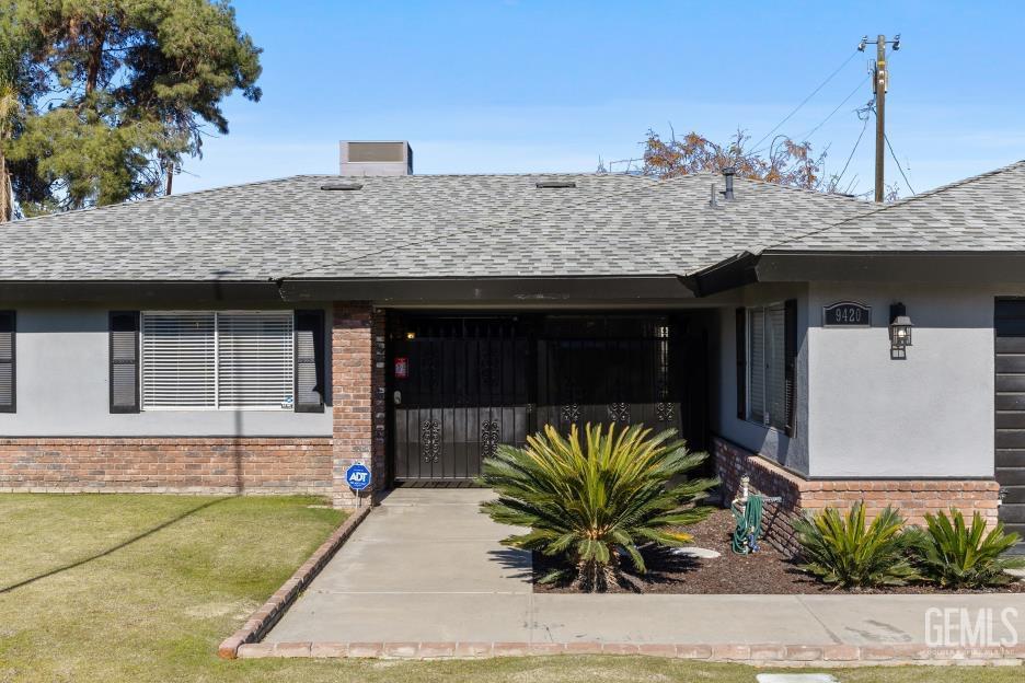 Undisclosed Address Bakersfield, CA 93312 - Photo 4 of 30 a front view of a house with a porch