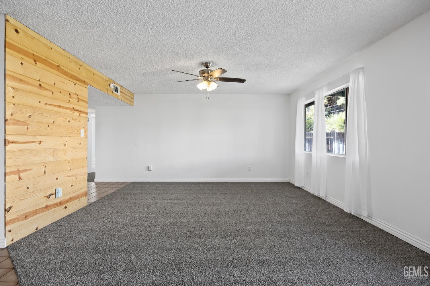 Undisclosed Address Bakersfield, CA 93312 - Photo 8 of 30 wooden floor in an empty room with a window