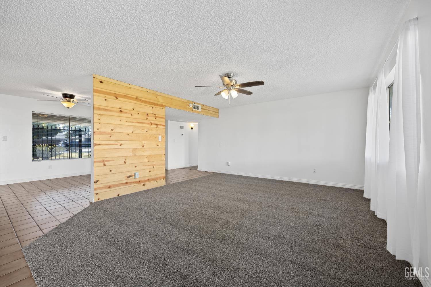 Undisclosed Address Bakersfield, CA 93312 - Photo 9 of 30 a view of an empty room with a window