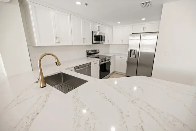 a kitchen with a stove and a microwave