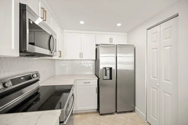a view of a bedroom with wooden floor and a window