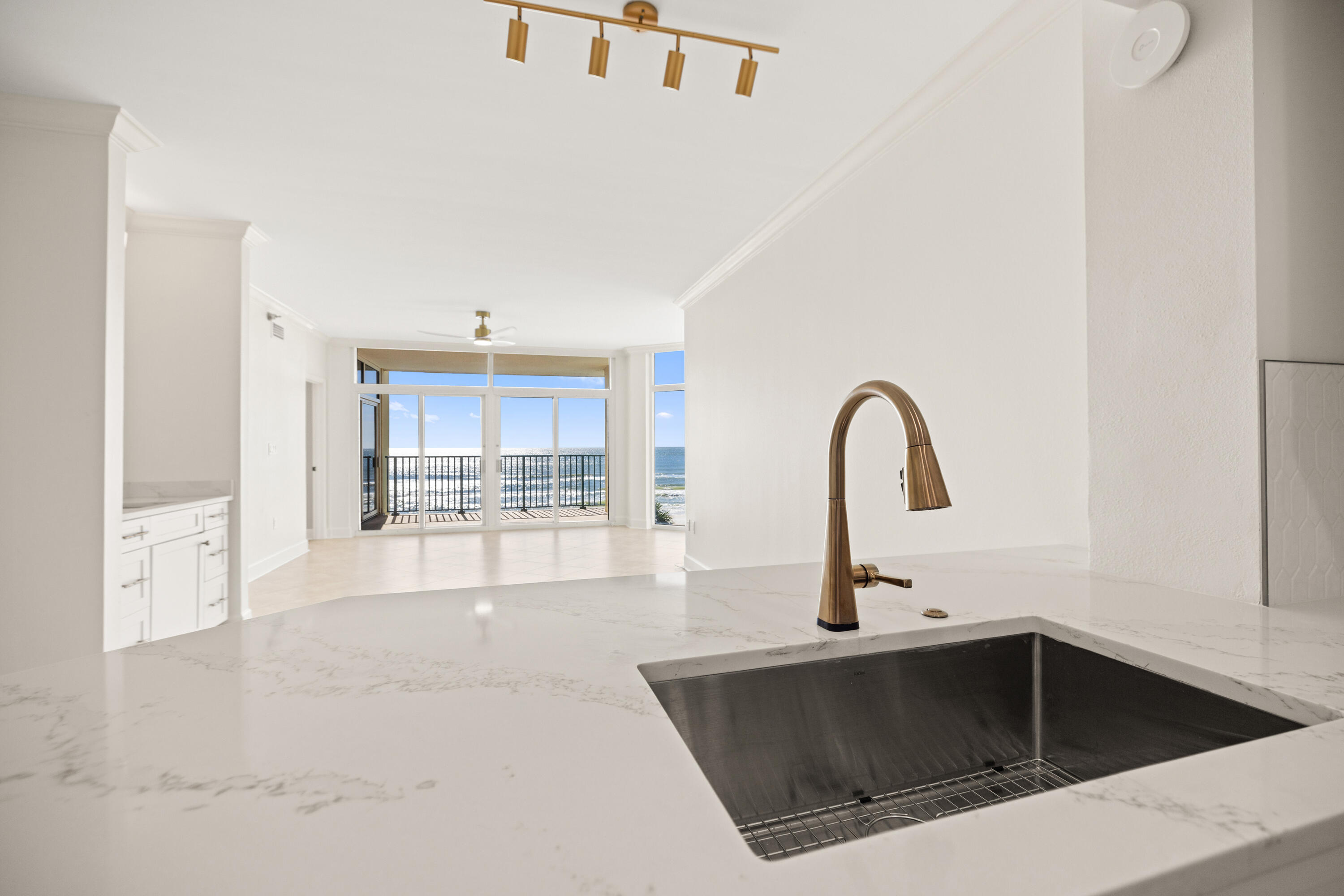 1018 Highway 98, Unit 340 Destin, FL 32541 - Photo 23 of 62 a kitchen with a sink and a microwave