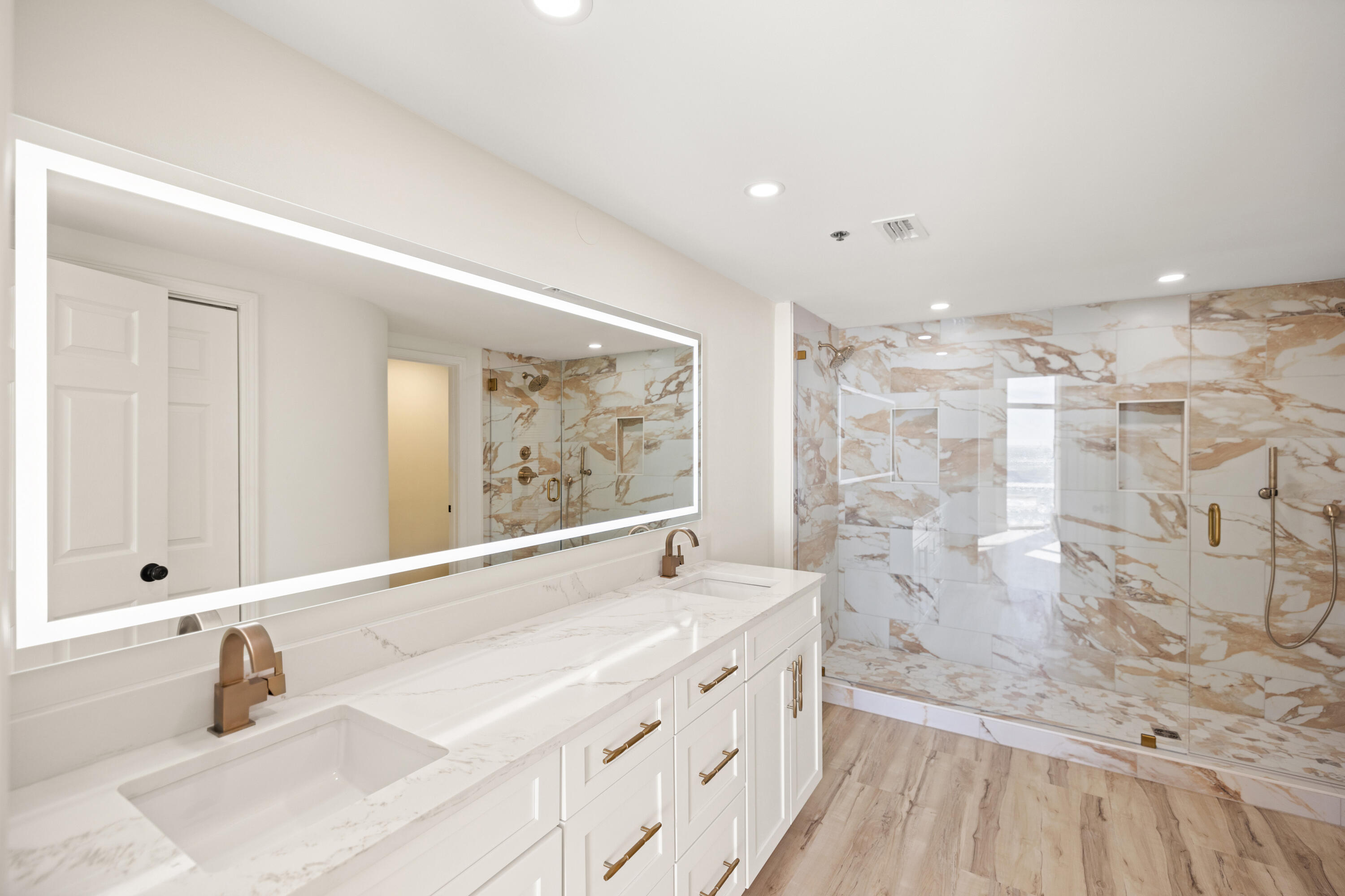 1018 Highway 98, Unit 340 Destin, FL 32541 - Photo 28 of 62 a bathroom with a double vanity sink mirror and shower