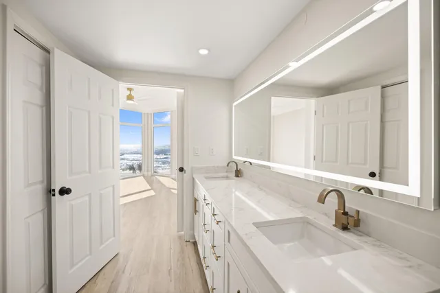 a bathroom with a glass shower door