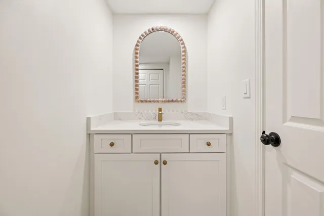 an empty room with wooden floor and a window