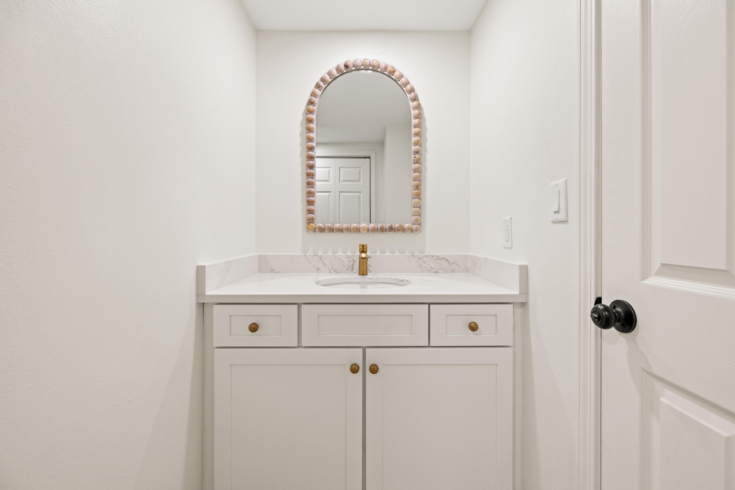 1018 Highway 98, Unit 340 Destin, FL 32541 - Photo 33 of 62 a bathroom with a sink and a mirror