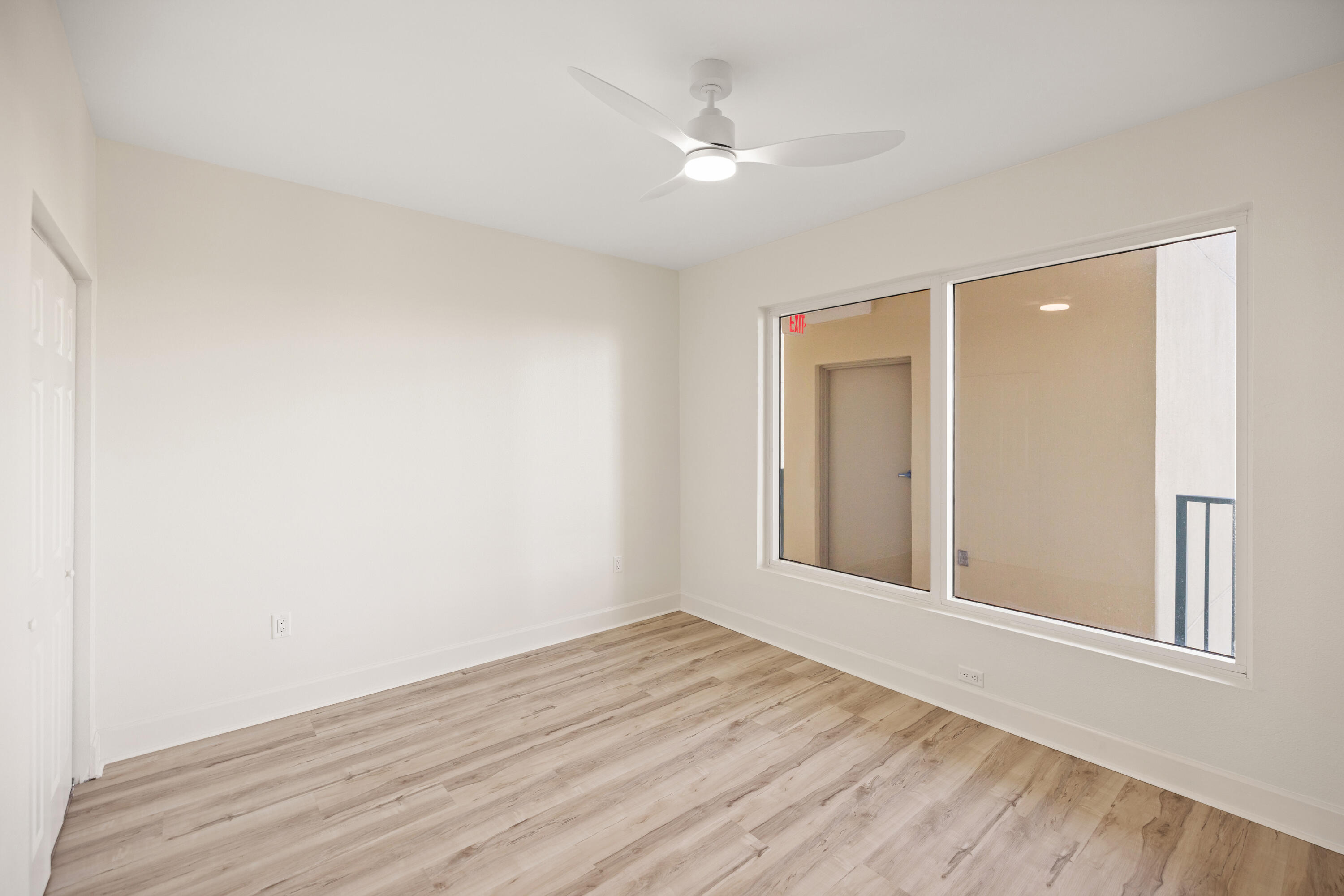 1018 Highway 98, Unit 340 Destin, FL 32541 - Photo 36 of 62 a view of an empty room with wooden floor