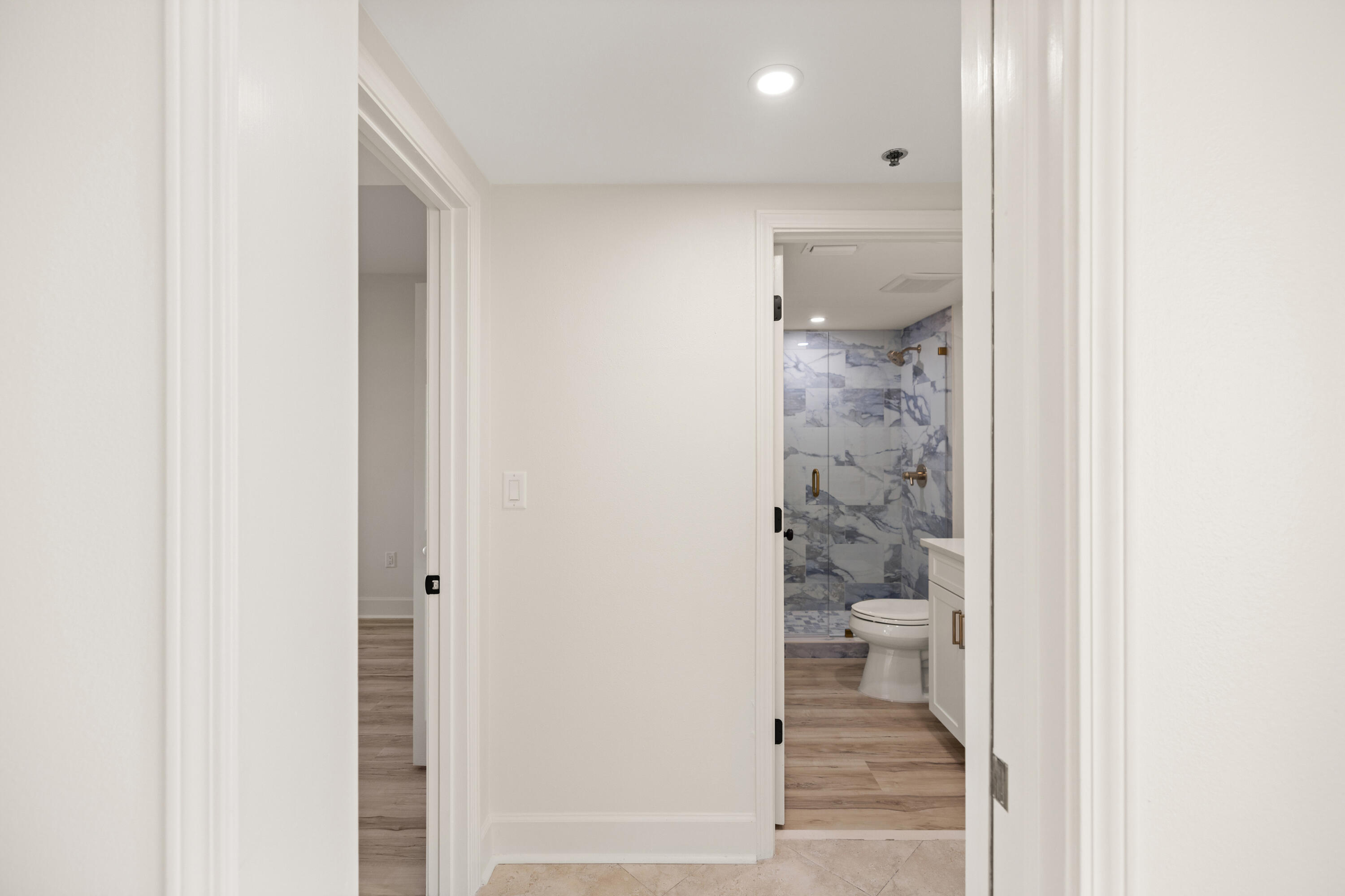 1018 Highway 98, Unit 340 Destin, FL 32541 - Photo 38 of 62 a bathroom with a glass shower door