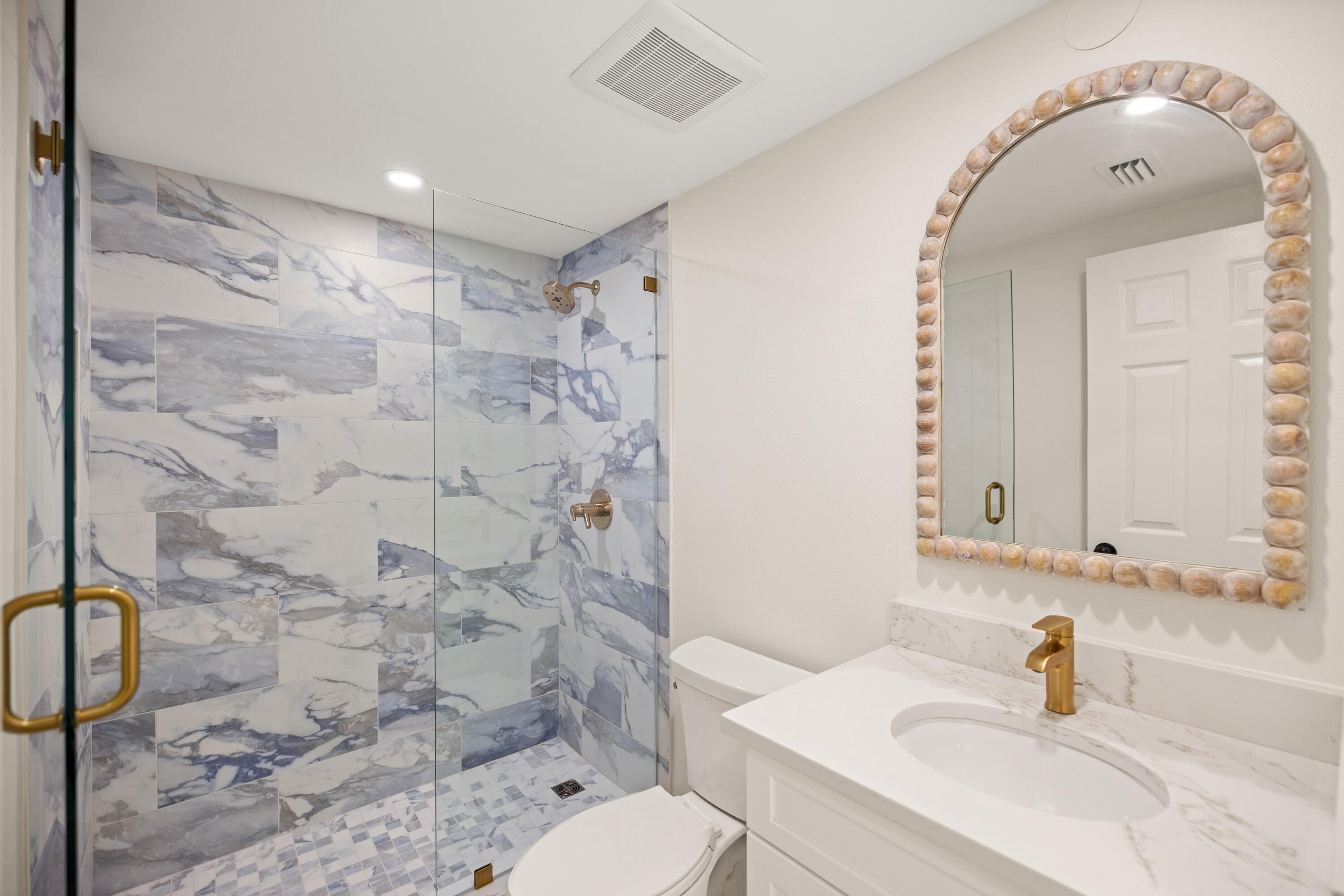 1018 Highway 98, Unit 340 Destin, FL 32541 - Photo 39 of 62 a bathroom with a sink toilet and shower