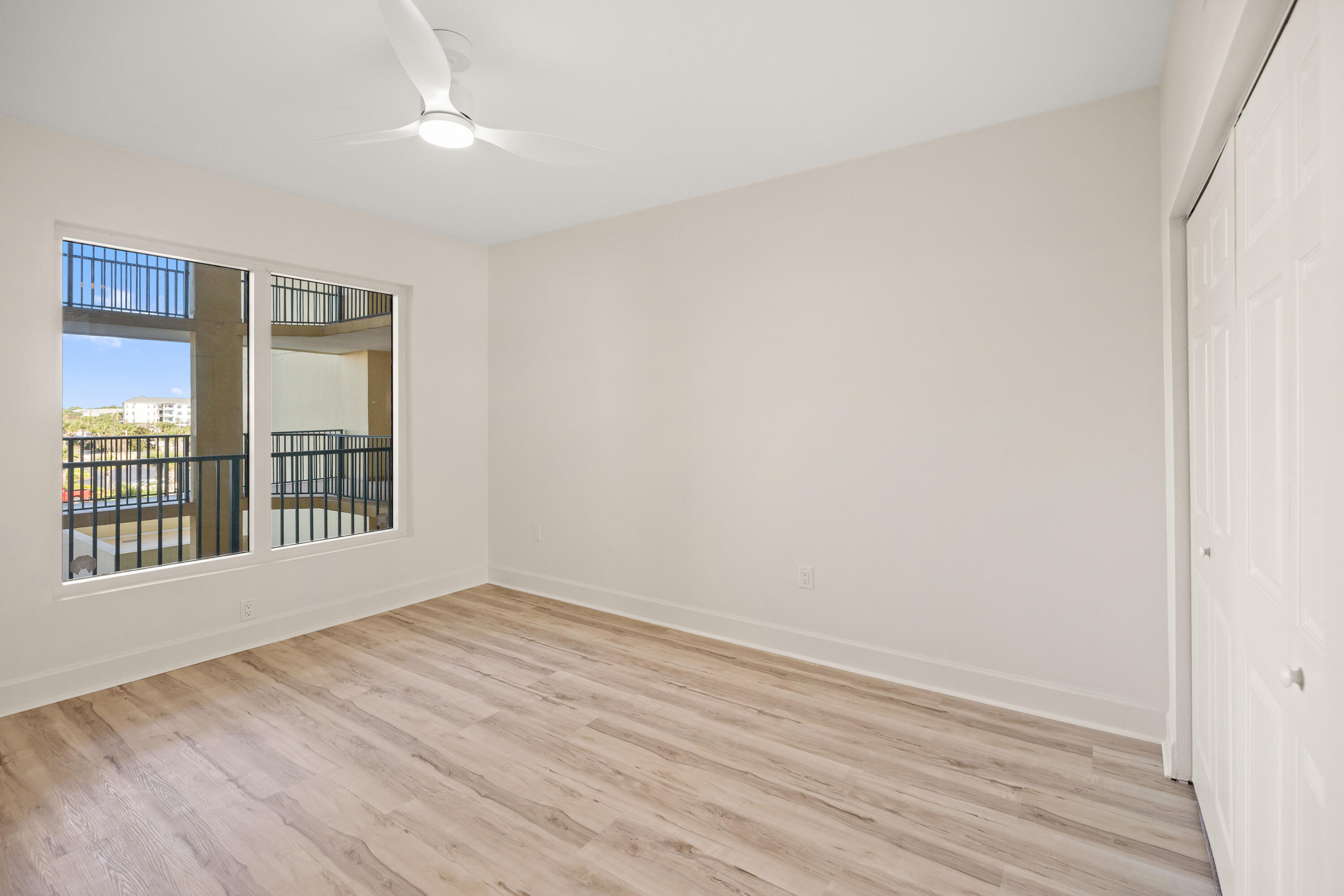 1018 Highway 98, Unit 340 Destin, FL 32541 - Photo 40 of 62 wooden floor in an empty room with a window