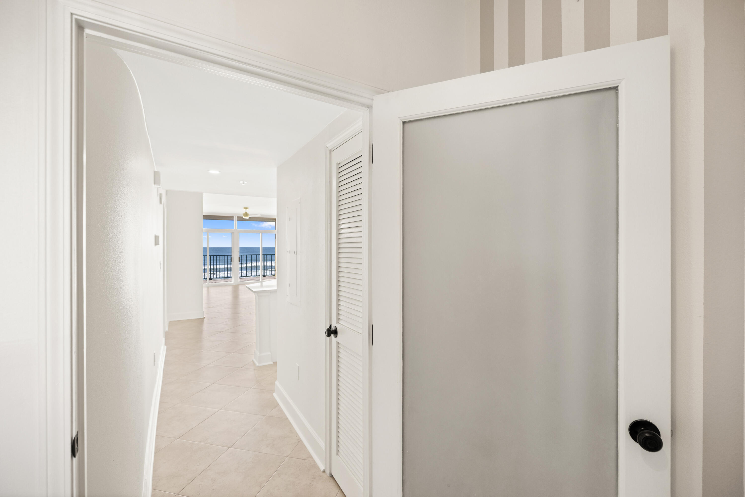1018 Highway 98, Unit 340 Destin, FL 32541 - Photo 45 of 62 a view of a bathroom from a hallway