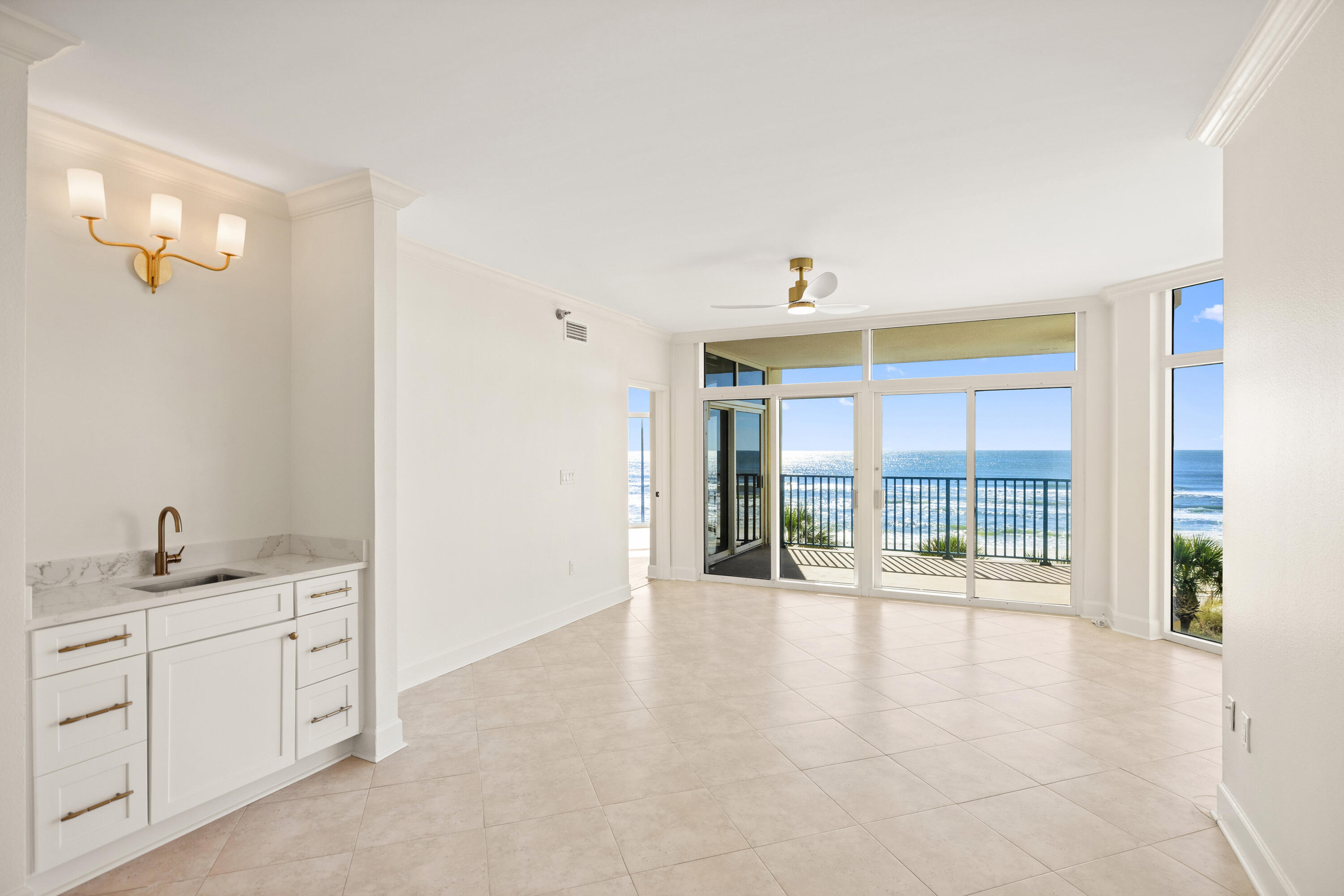 1018 Highway 98, Unit 340 Destin, FL 32541 - Photo 6 of 62 a hallway with a large window and chandelier