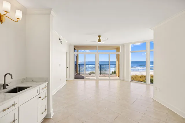 a kitchen with stainless steel appliances a stove a sink a oven and cabinets