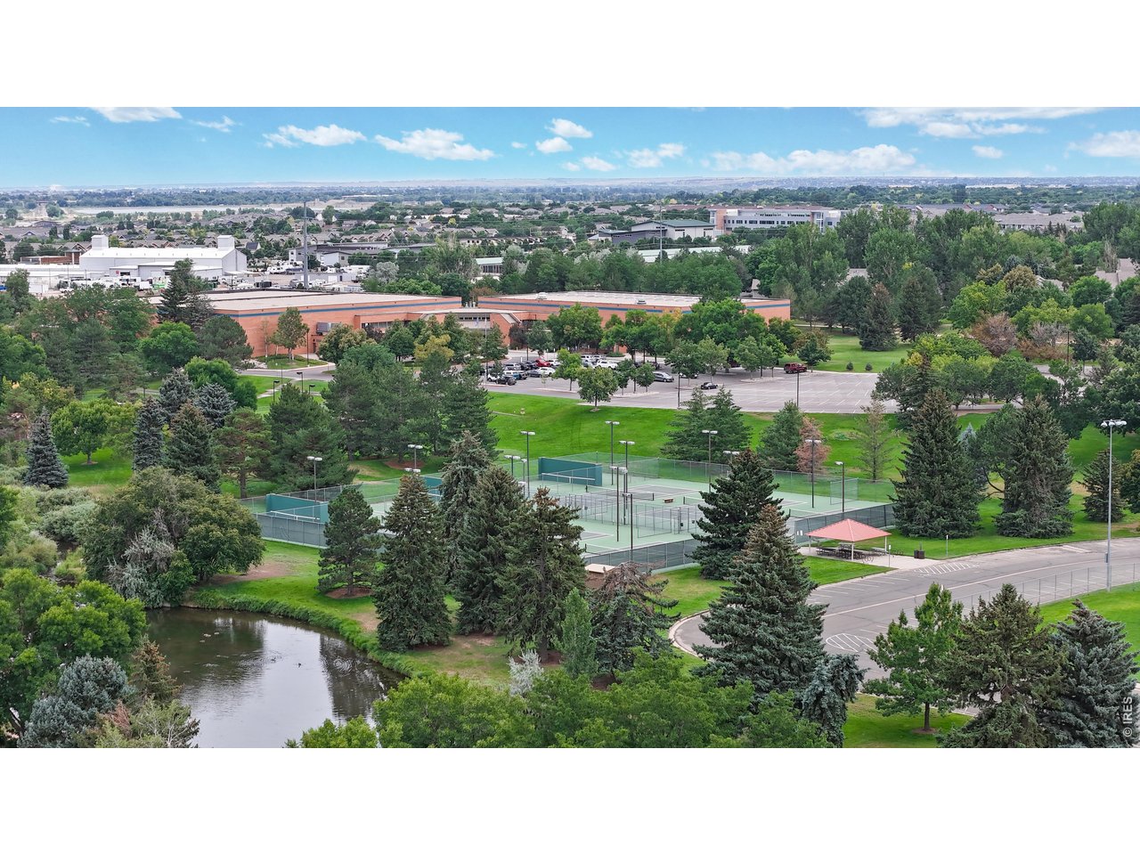 1440 Edora Road, Unit 19 Fort Collins, CO 80525 - Photo 27 of 30 The nearby EPIC recreation center, tennis courts, a pond, and green space within walking distance
