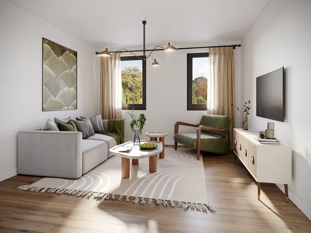 a living room with furniture and a flat screen tv