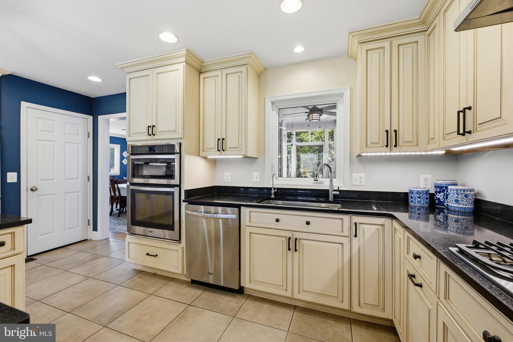 319 Wye Road Queenstown, MD 21658 - Photo 11 of 29 a kitchen with stainless steel appliances granite countertop a stove a sink and a refrigerator