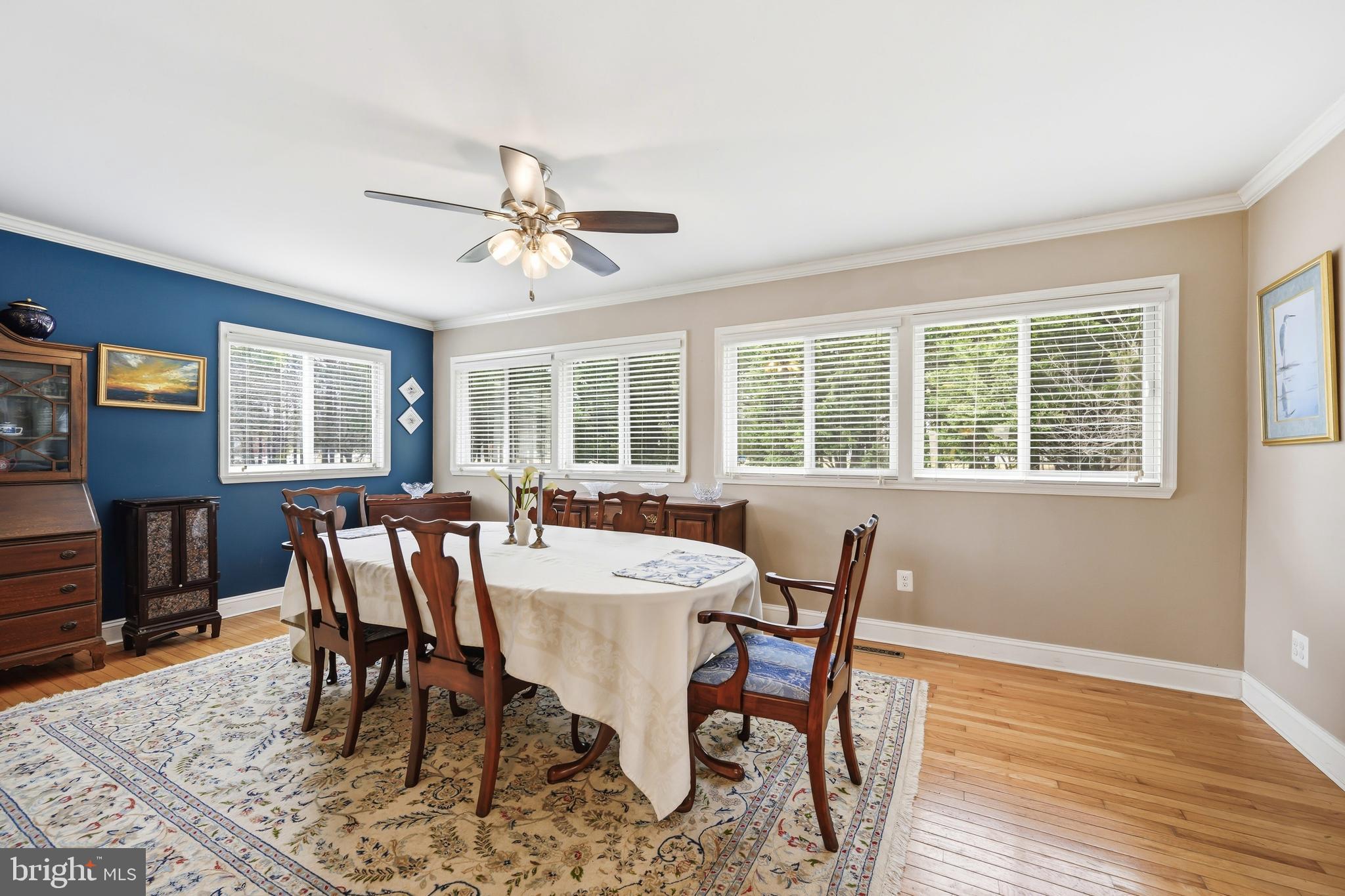 319 Wye Road Queenstown, MD 21658 - Photo 12 of 29 a view of a dining room with furniture window and wooden floor