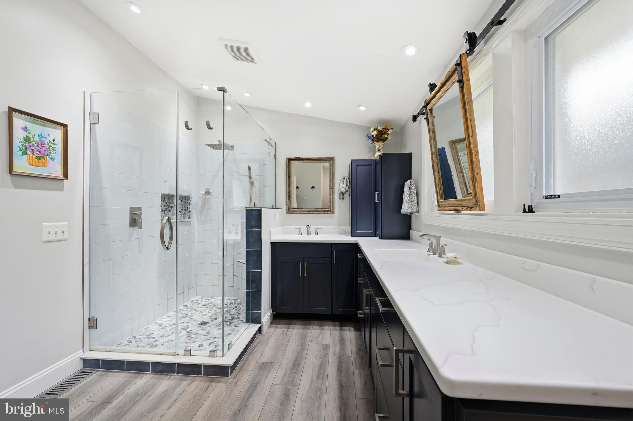 319 Wye Road Queenstown, MD 21658 - Photo 16 of 29 a large bathroom with a double vanity sink and mirror
