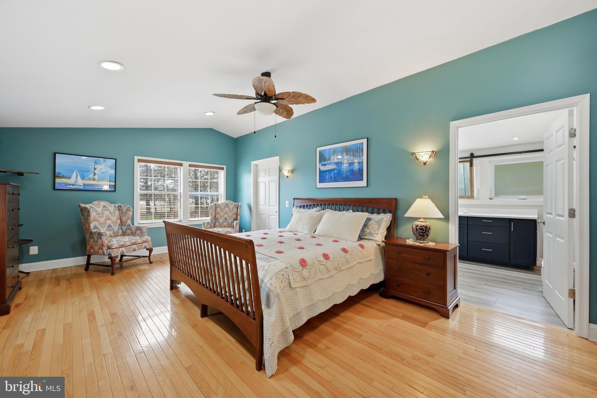 319 Wye Road Queenstown, MD 21658 - Photo 17 of 29 a bed room with a bed and a chair