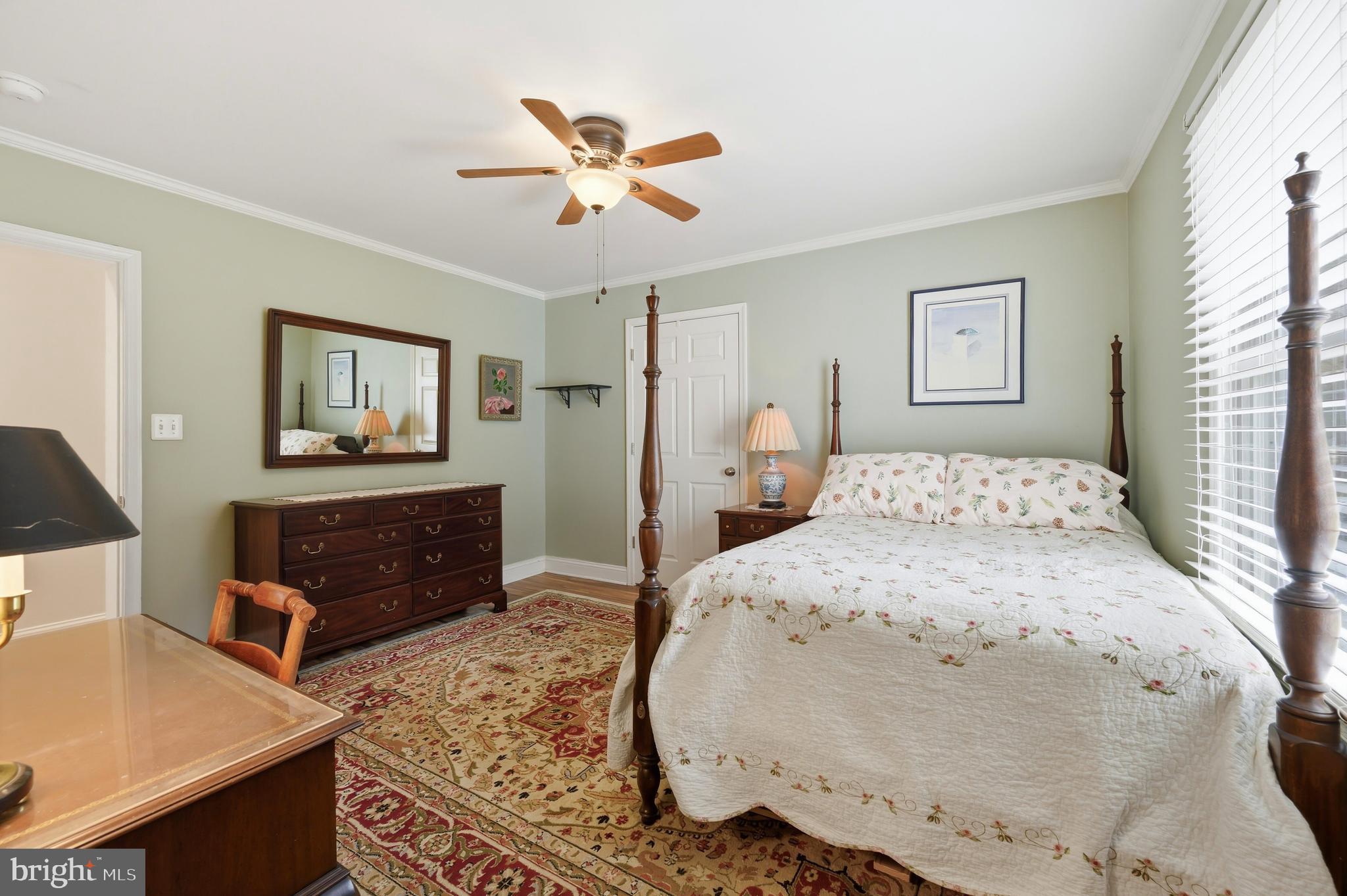 319 Wye Road Queenstown, MD 21658 - Photo 21 of 29 a bedroom with a bed and a dresser