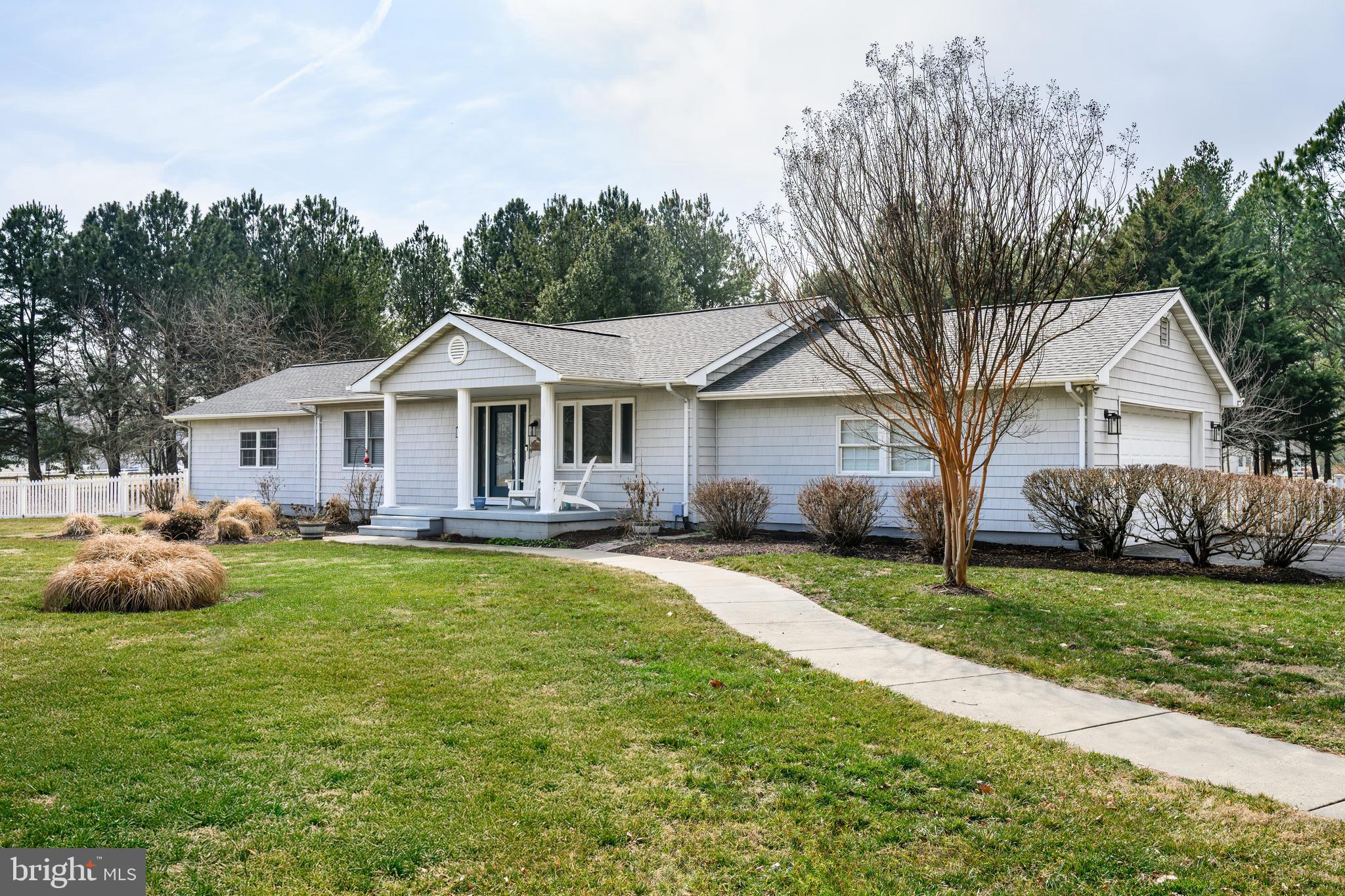 319 Wye Road Queenstown, MD 21658 - Photo 27 of 29 a front view of a house with a garden
