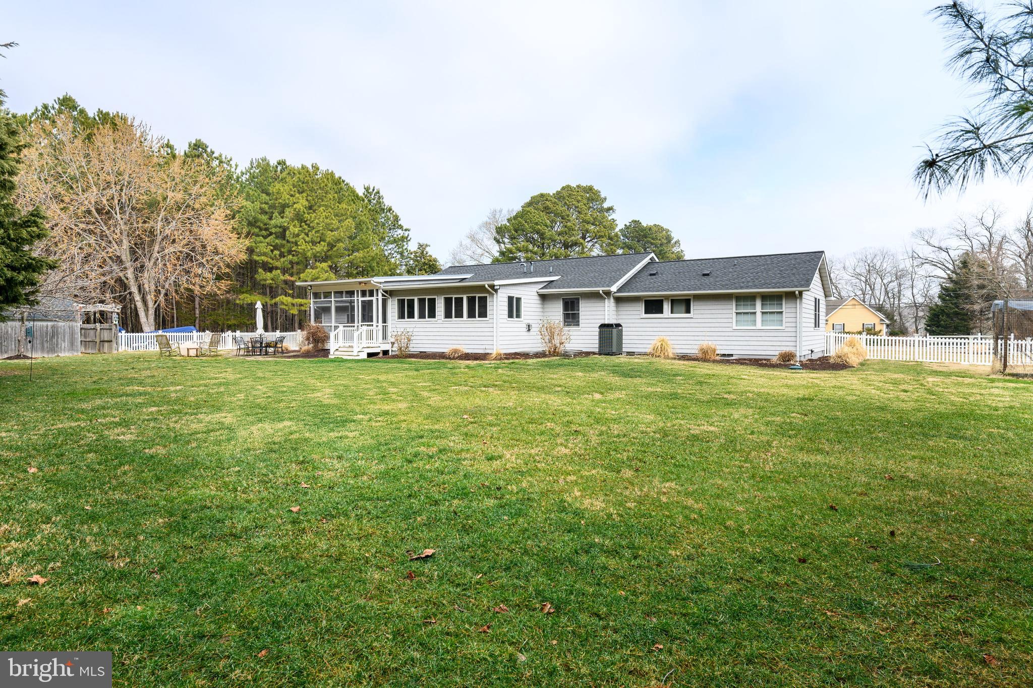 319 Wye Road Queenstown, MD 21658 - Photo 28 of 29 a view of a house with a big yard and large trees