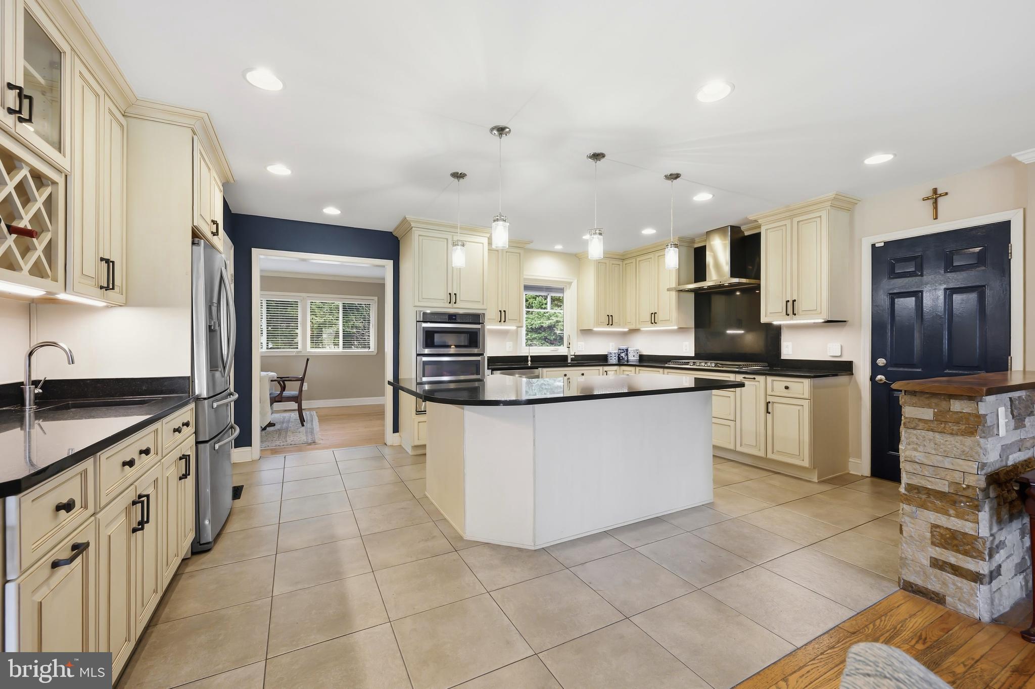 319 Wye Road Queenstown, MD 21658 - Photo 3 of 29 a large kitchen with stainless steel appliances kitchen island granite countertop a sink and cabinets