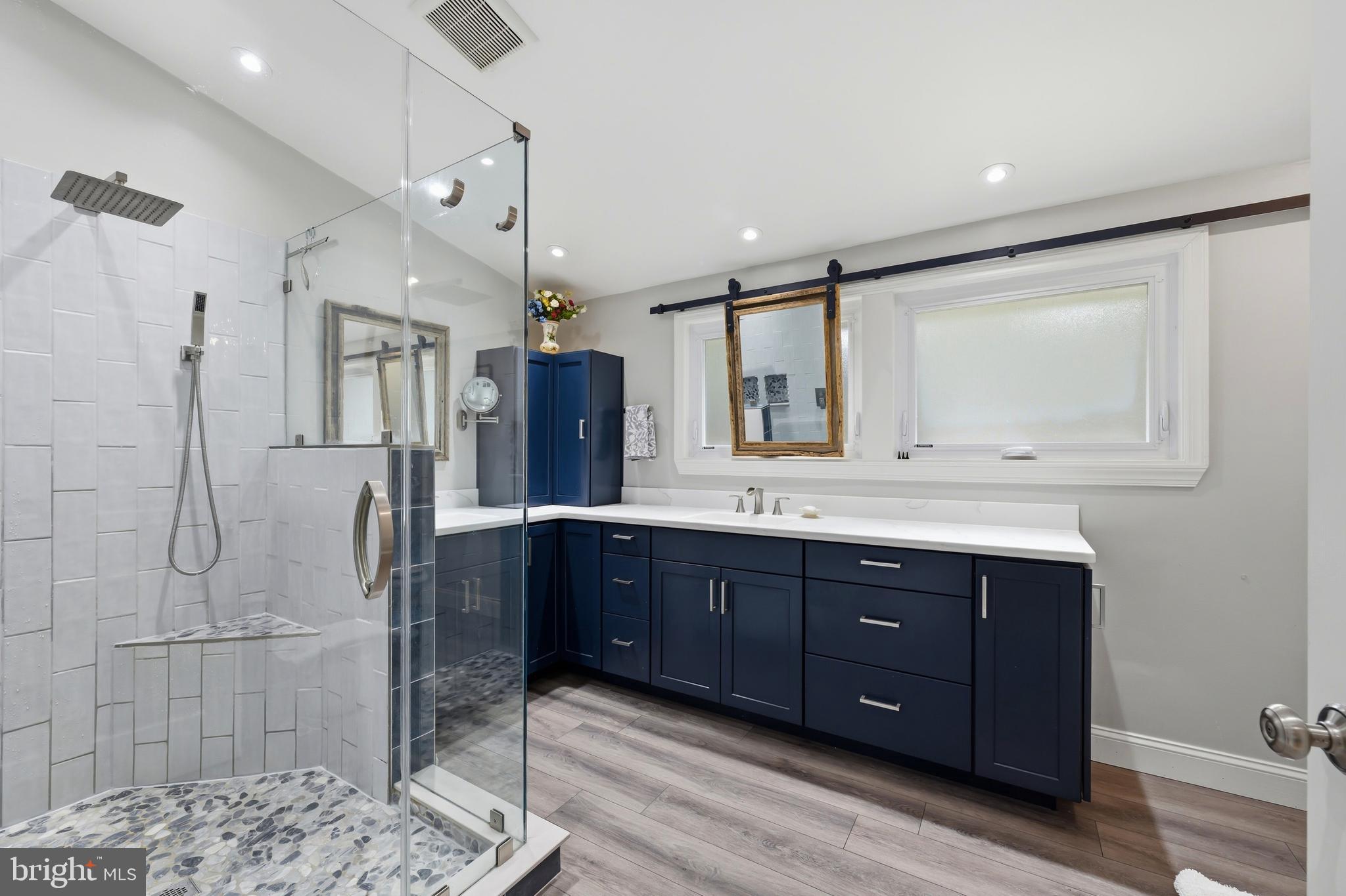 319 Wye Road Queenstown, MD 21658 - Photo 5 of 29 a bathroom with a sink mirror and a shower