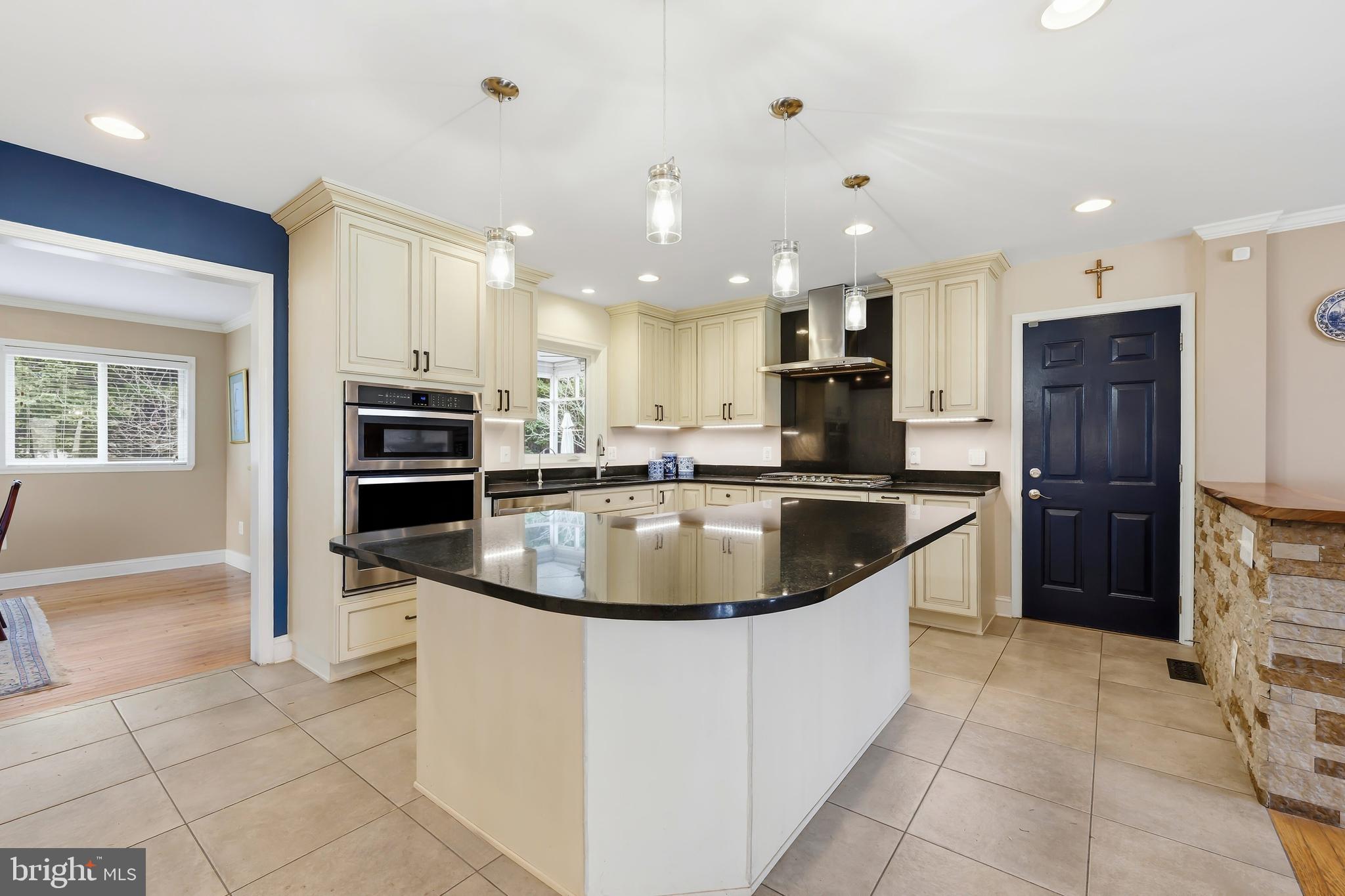 319 Wye Road Queenstown, MD 21658 - Photo 9 of 29 a kitchen with a sink stainless steel appliances and cabinets