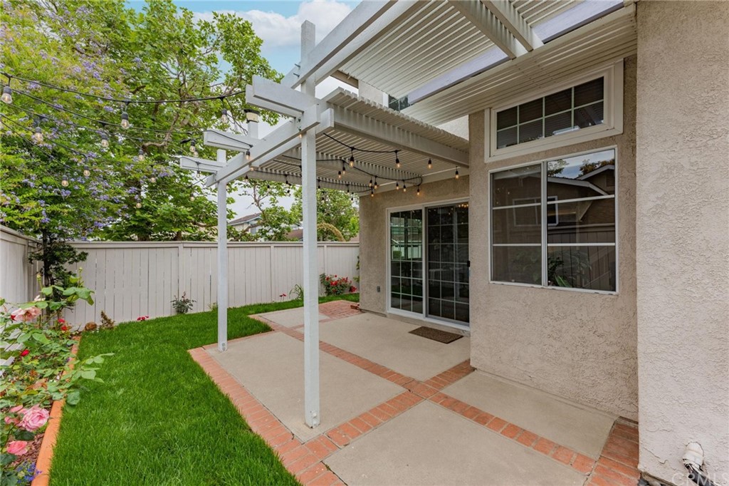17 Leesburg Irvine, CA 92620 - Photo 34 of 48 Amazing back yard and covered patio with warm cafe lights, perfect for alfresco entertaining.