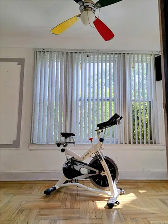 a room with gym equipment and a large window