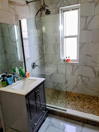 a bathroom with a sink and a mirror