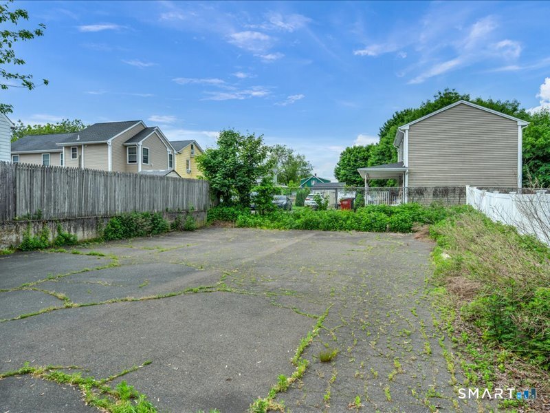 61 Maple Avenue Wallingford, CT 06492 - Photo 20 of 20 a house with a yard