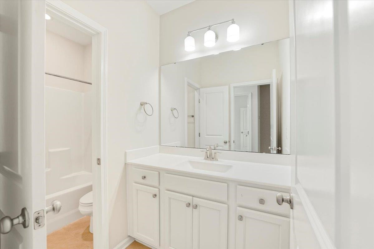 203 Zante Currant Road Durham, NC 27703 - Photo 17 of 28 Toilet and shower are seperated from vanity helping to avoid the "potty dance" while someone else is taking their time brushing teeth. Upstairs Hall Bathroom