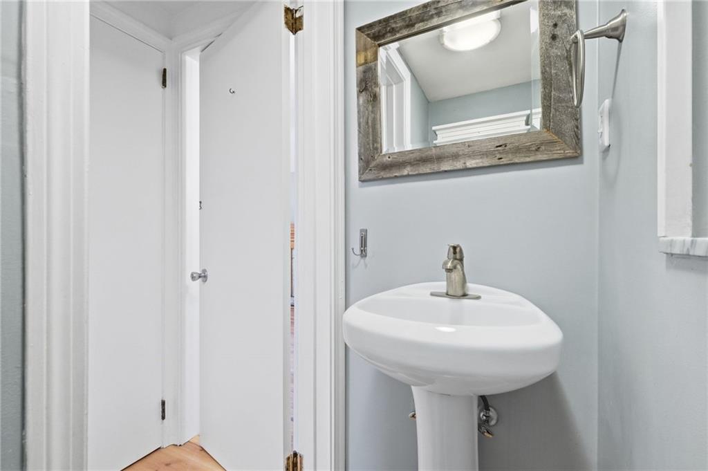 419 Burlington Road Pittsburgh, PA 15221 - Photo 18 of 38 a bathroom with a sink and a mirror
