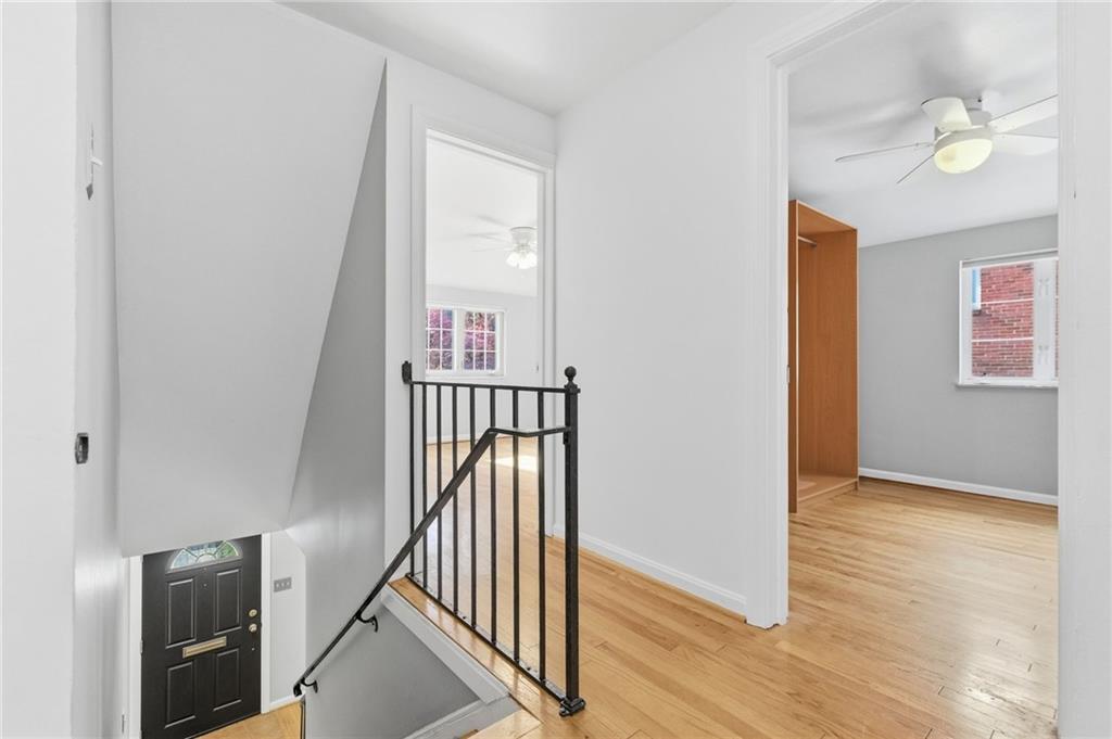 419 Burlington Road Pittsburgh, PA 15221 - Photo 19 of 38 a view of a hallway with wooden floor and entryway