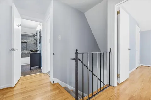 a view of an empty room with white walls