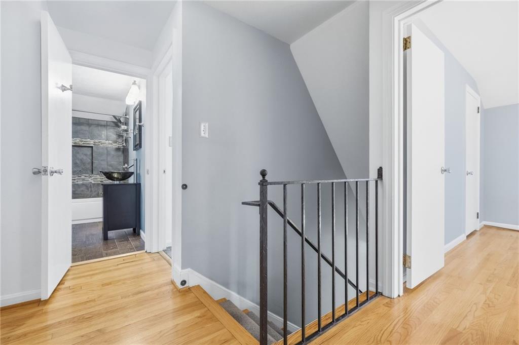 419 Burlington Road Pittsburgh, PA 15221 - Photo 20 of 38 a view of a hallway with wooden floor and staircase
