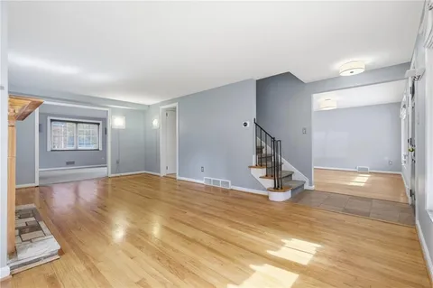 a view of an empty room and window