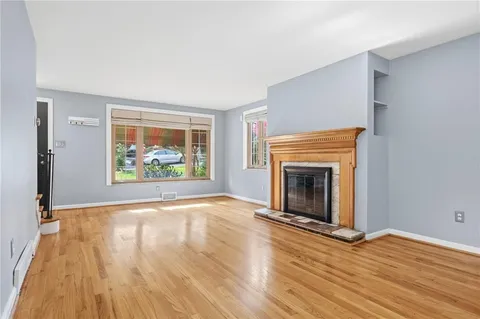 a kitchen with a stove a refrigerator and a sink